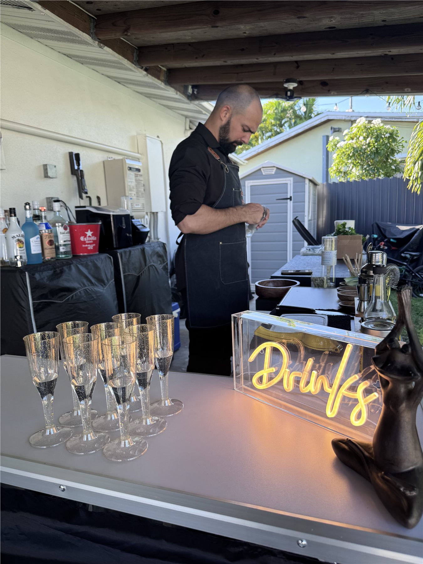Tipsy Tides bartender preparing drinks for guests