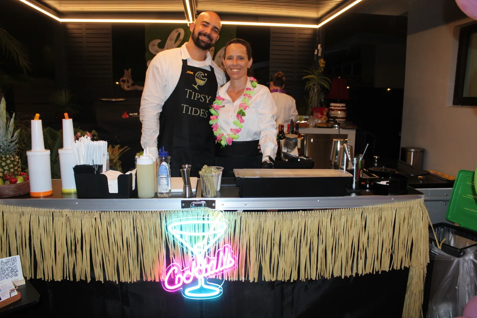Tipsy Tides team together behind the mobile bar